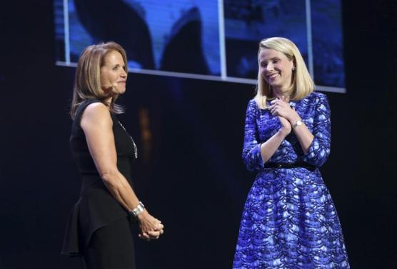 Yahoo CEO Marissa Mayer greets journalist Katie Couric on stage during Mayer's keynote speech at the annual Consumer Electronics Show (CES) in Las Vegas